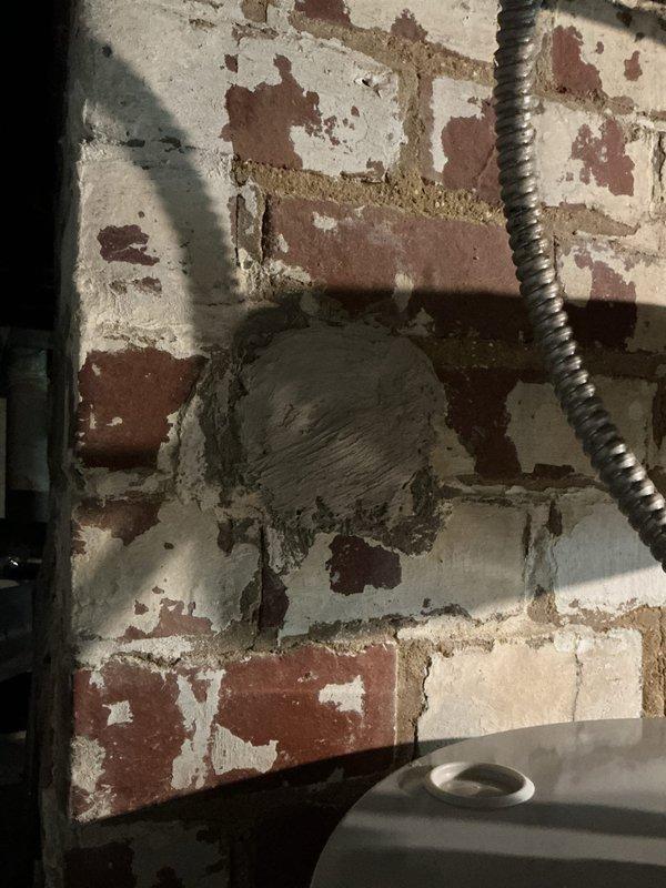 Replaced illegally installed 40-gallon gas water heater that had been red-tagged by the gas company with a new Bradford White 50-gallon electric water heater with 6-year manufacturer warranty. Removed existing CPVC shut-off valves and installed transition couplings above the water heater to connect from CPVC to copper piping. Installed new cold water shut-off valve, expansion tank, and drip leg on the temperature and pressure relief valve. Patched the existing chimney opening where the previous gas water heater vented and capped off the gas line to complete the conversion from gas to electric operation.