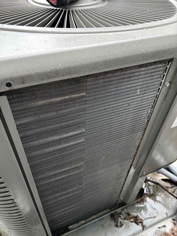 Completed comprehensive AC tune-up on 6-year-old outdoor condensing unit. Performed standard maintenance protocol including inspection of condenser coils, fan assembly, and electrical components; unit operational with normal airflow and no issues identified. Cleaned debris from base area and verified proper operation of all systems.