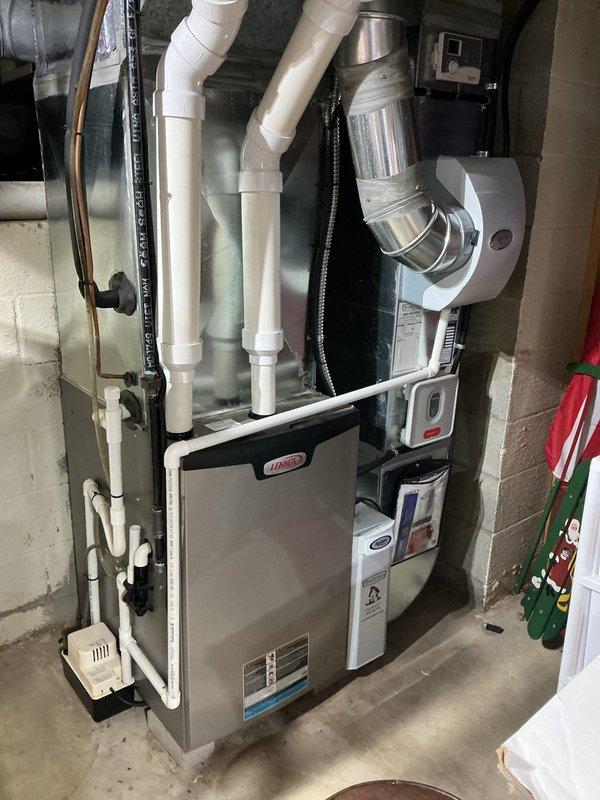 Completed routine maintenance inspection on Lennox residential cooling system for MVP customer. Unit is approximately 2-3 years old and consists of outdoor condenser with indoor furnace and ductwork assembly. Performed visual inspection of both indoor and outdoor components, verified proper refrigerant line connections, checked condensate drain routing, and confirmed all electrical connections are secure. System operating within normal parameters with no immediate service needs identified.