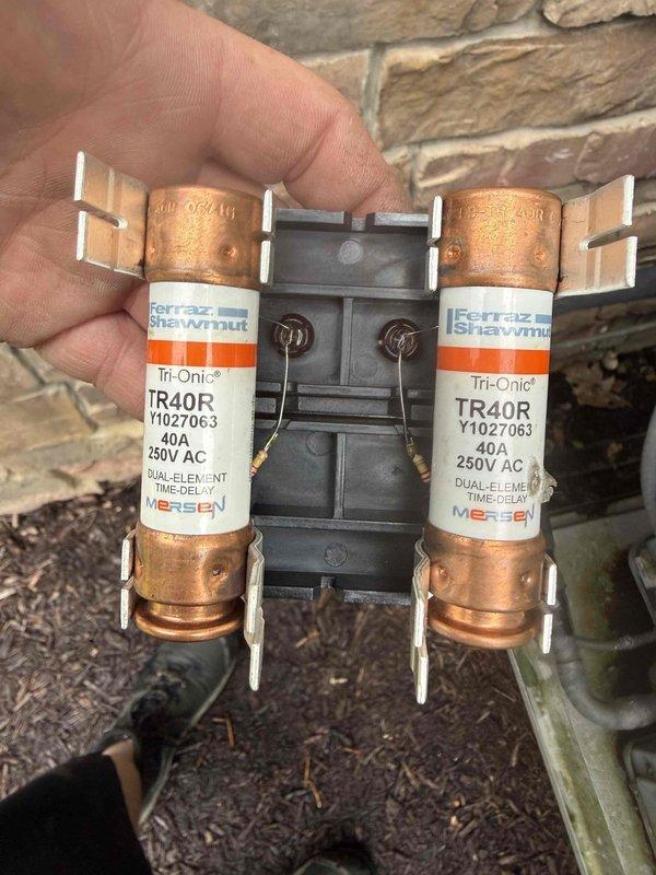 Installed soft start kit on HVAC system requiring upgraded electrical service. Replaced existing disconnect box with new 60-amp disconnect and dual-element time-delay fuses rated at 40A/250V AC to accommodate equipment specifications and ensure proper circuit protection.