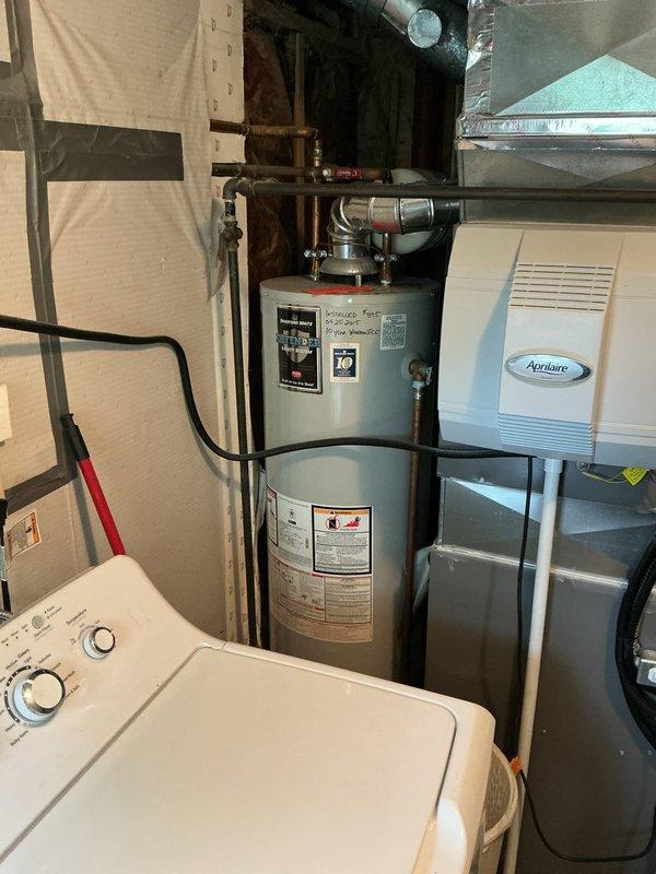 Responded to service request for estimate on main water line valve replacement at street connection. Performed on-site assessment of existing water service entrance and documented current conditions with photographs. Evaluated utility area containing water heater, washing machine, and HVAC equipment to determine scope of work required for valve replacement. Water service remained active during inspection as requested. Prepared estimate for main shut-off valve replacement and provided recommendations for future service scheduling.