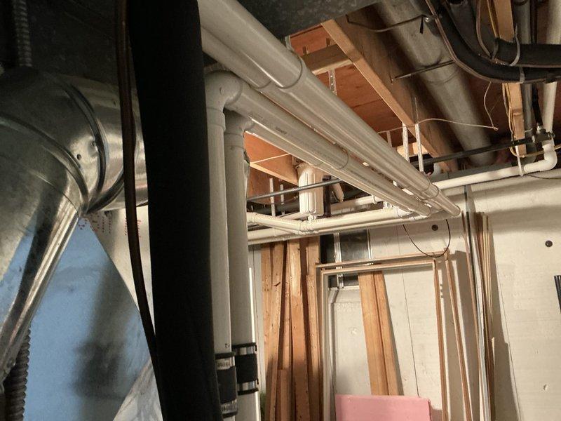 Conducted comprehensive HVAC system assessment for equipment replacement estimate in residential basement utility area. Evaluated existing ductwork infrastructure, including galvanized metal components and flexible connections, along with clearances and access points for new system installation. Documented current mechanical layout, structural framing, and utility routing to determine optimal equipment placement and installation requirements.