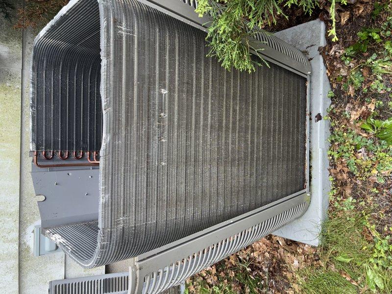 Completed preventive maintenance inspection on residential split-system air conditioning unit. Performed visual assessment of outdoor condenser, confirming heat exchanger coils and aluminum fins in serviceable condition with minimal debris accumulation. Verified refrigerant line connections secure with protective caps intact, electrical components and wiring properly seated, and unit housing structurally sound. Documented equipment condition through photographic records for maintenance history tracking.