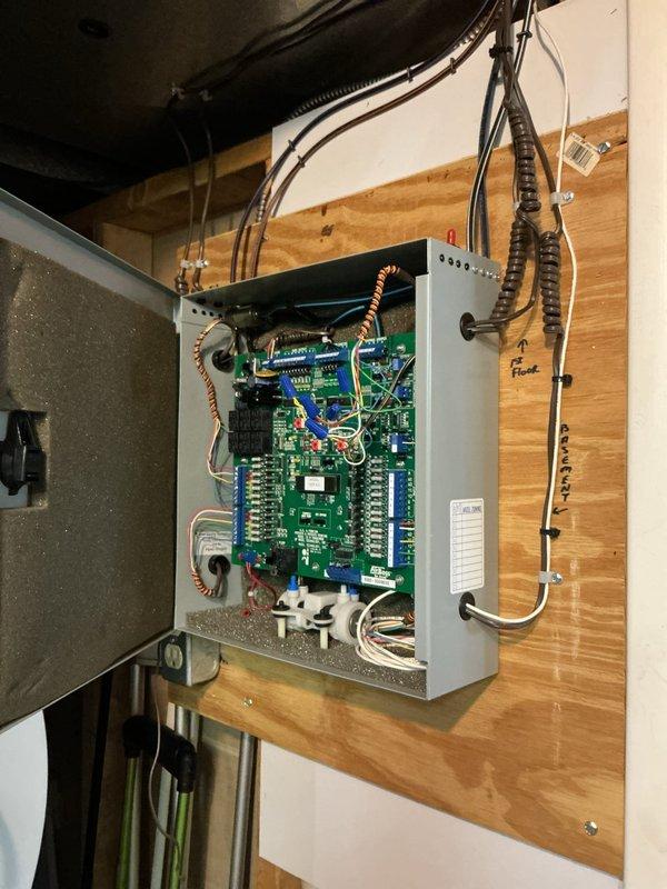 Returned to site to replace defective transformer on the zone control board. Removed existing panel cover, disconnected faulty transformer, and installed new replacement unit. Verified all wire connections to terminal blocks, tested board functionality with LED indicators, confirmed proper operation of all zones, and secured panel enclosure.
