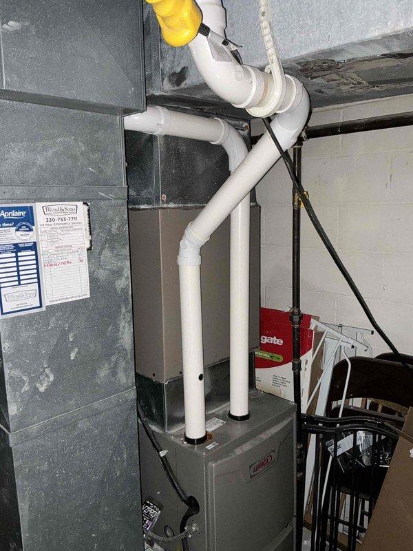 Completed estimate for replacement of 15-year-old air conditioning system experiencing refrigerant leak. Assessed existing Lennox HVAC installation including furnace, ductwork configuration, and drainage/venting system in basement mechanical room. Documented current equipment condition and provided replacement recommendations.