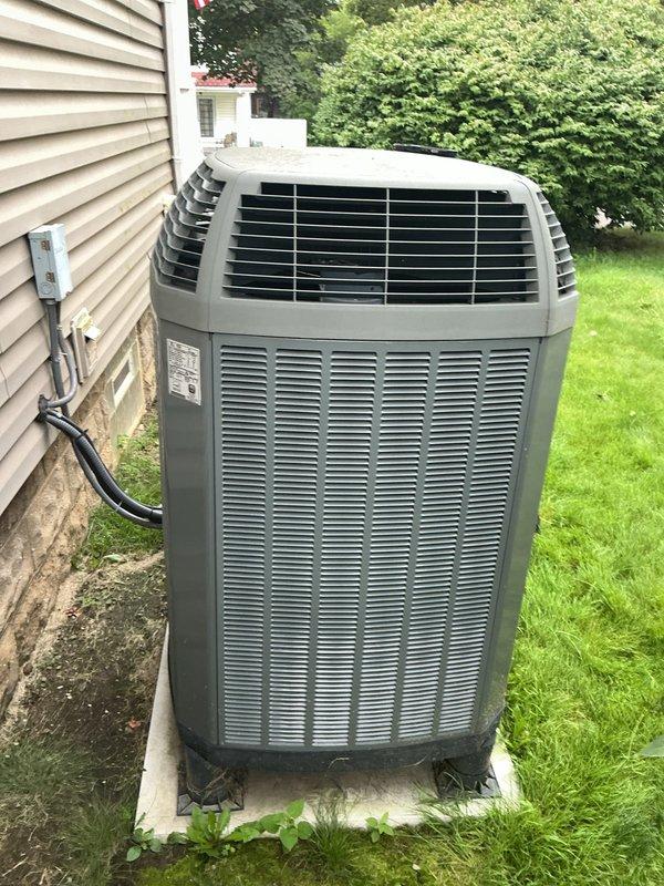 Completed scheduled maintenance visit on residential air conditioning system over 10 years old for MVP customer. Performed comprehensive inspection of outdoor condensing unit, accessing electrical compartment to examine all internal components including capacitor, wiring connections, and terminal blocks. All electrical connections were verified secure, capacitor tested and found operational, and unit exterior inspected for proper airflow through louvers and top grille assembly. System operating within normal parameters upon completion of service call.