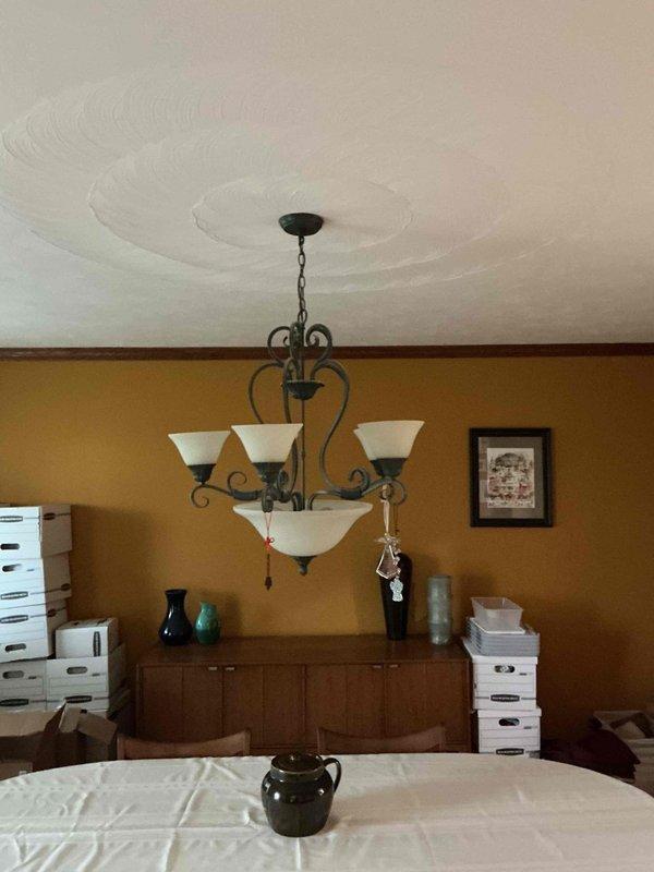 Conducted on-site assessment for chandelier installation in entryway and evaluated feasibility of adding recessed can lighting in living room. Documented existing electrical conditions, ceiling structure, and fixture locations to provide accurate quote for proposed lighting upgrades.