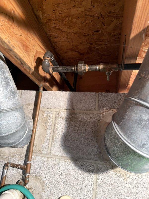 Responded to service call for gas line assessment prior to dryer installation. Previous installation attempt by third-party appliance installer was halted due to concerns about shutting off gas supply to the residence. Performed comprehensive inspection of existing natural gas piping system in crawlspace and attic areas, examining gas line routing, connections, and shutoff valve accessibility. Verified proper gas line sizing and configuration for dryer connection. Documented existing copper gas piping, support strapping, and connection points throughout the mechanical spaces. Confirmed gas system integrity and provided clearance for appliance installation to proceed safely.
