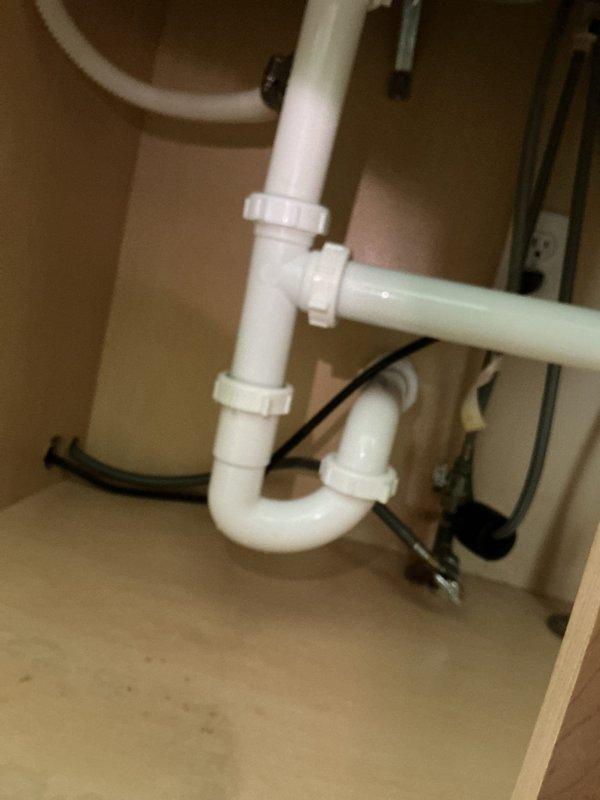 Responded to a service call for a clogged bathtub drain and leaking kitchen sink pipes. Successfully cleared the bathtub drain obstruction and inspected the kitchen sink P-trap assembly and connecting pipes for the source of the leak. Addressed both plumbing issues to restore proper drainage and eliminate water leakage beneath the kitchen sink.