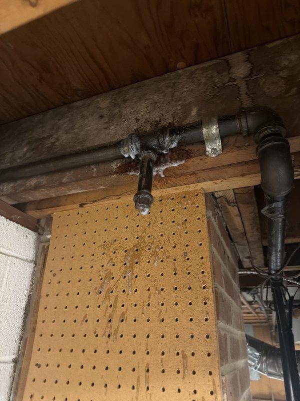 Responded to service call for removal of capped gas line in basement from decommissioned fireplace. Upon arrival, located the abandoned gas line running along basement ceiling joists near concrete block foundation wall. Safely disconnected and removed the gas line section, ensuring proper capping at the main supply point per code requirements. Verified no active gas flow and confirmed structural integrity of surrounding area post-removal.
