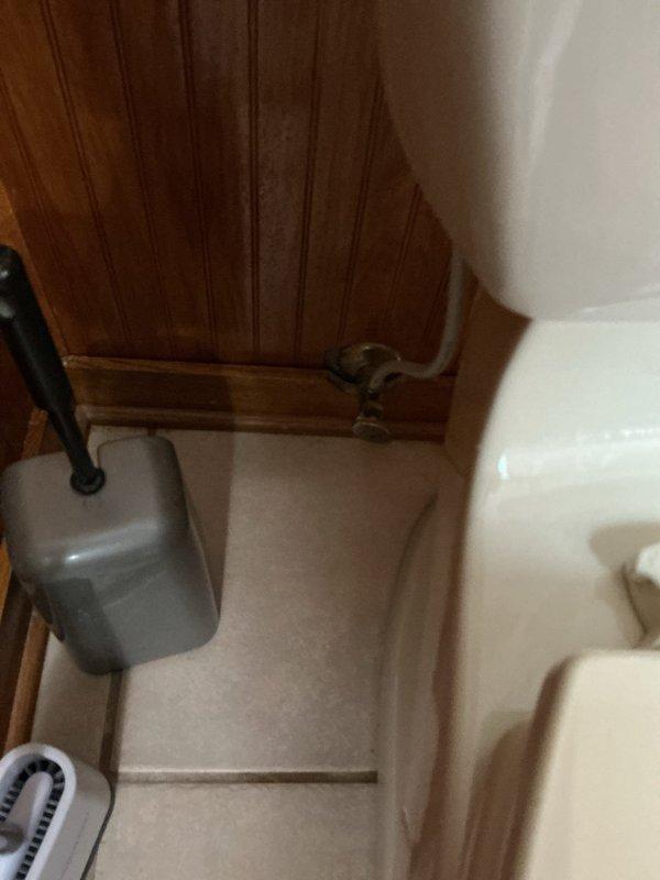 Responded to complaint of toilet continuously running water every 5-10 minutes after flushing in 1991-built residence. Upon inspection, removed tank lid from American Standard model 4266 toilet and identified faulty flapper valve assembly causing intermittent refill cycles. The existing green and blue circular flapper showed signs of deterioration and was not sealing properly against the flush valve seat, allowing water to slowly leak from tank to bowl and triggering the fill valve to activate repeatedly. Replaced worn flapper with new compatible unit, adjusted chain length for proper closure, and tested flush mechanism multiple times to verify complete seal and proper water level maintenance. Confirmed fill valve and overflow tube were functioning correctly with no additional adjustments needed. System now operates normally with no phantom flushing between use cycles.