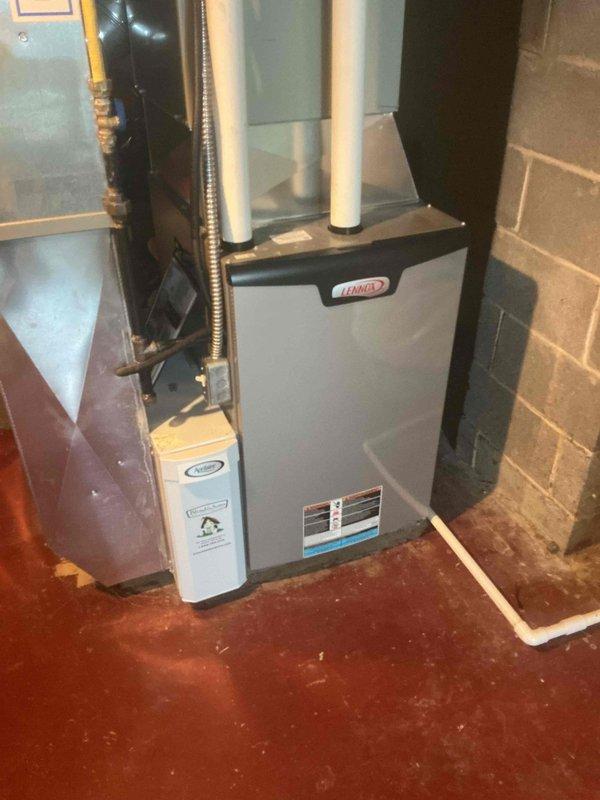 Completed comprehensive MVP air conditioning maintenance on Lennox HVAC system. Performed thorough inspection of outdoor condensing unit, verified proper operation of compressor and condenser fan, checked refrigerant levels, cleaned condenser coils, and inspected electrical connections at outdoor unit. Evaluated indoor furnace cabinet and associated ductwork connections, confirmed proper airflow through system, and documented equipment condition with photographic records. All components operating within normal parameters with no deficiencies noted.