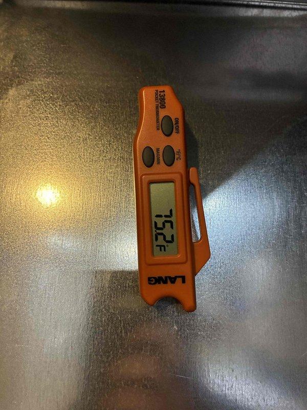 Completed MVP cooling maintenance visit on residential HVAC system. Performed temperature diagnostics using calibrated digital thermometer, recording supply air temperature of 53.2°F at the unit. Inspected exterior condenser unit panels and filter media, noting accumulation of dust, debris, and organic matter on filtration surfaces and evidence of algae growth on concrete pad, consistent with normal outdoor exposure and operational wear.