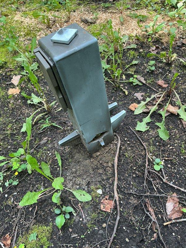 Responded to service call for evaluation of electrical outlets and wiring safety concerns. Upon arrival, conducted thorough inspection of outdoor electrical equipment enclosure and associated components found in exterior location with overgrown vegetation. Assessed weathered utility box mounted on metal support brackets and examined displaced ductwork component discovered on ground nearby. Documented conditions of electrical infrastructure through photographs to verify equipment status and identify any potential safety hazards requiring remediation or further action.