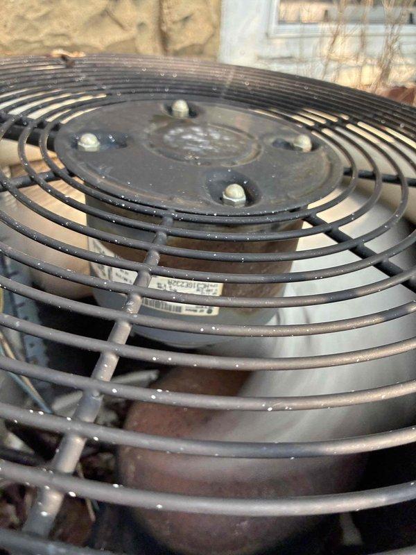 Completed comprehensive MVP AC maintenance on residential cooling system. Performed thorough inspection of outdoor condenser unit including fan assembly, verified proper operation of fan motor and blade, and checked for debris accumulation within protective guard. Measured and recorded temperature readings using digital instrumentation, documenting system performance at 174°F. Inspected ductwork and mechanical components in utility area, checking for proper insulation integrity and identifying any signs of wear or deterioration on metal surfaces and connections.