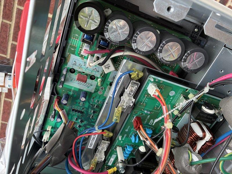 Responded to service call for multiple mini-split systems that failed to operate following a power outage. Performed diagnostic inspection of outdoor condensing unit, accessing internal control panel and electrical components. Inspected control boards, capacitors, wiring connections, and refrigerant line set for damage or loose connections caused by power surge. All circuit boards, capacitors, terminal blocks, and electrical connections were examined and found to be in functional condition with no visible signs of electrical damage or component failure.