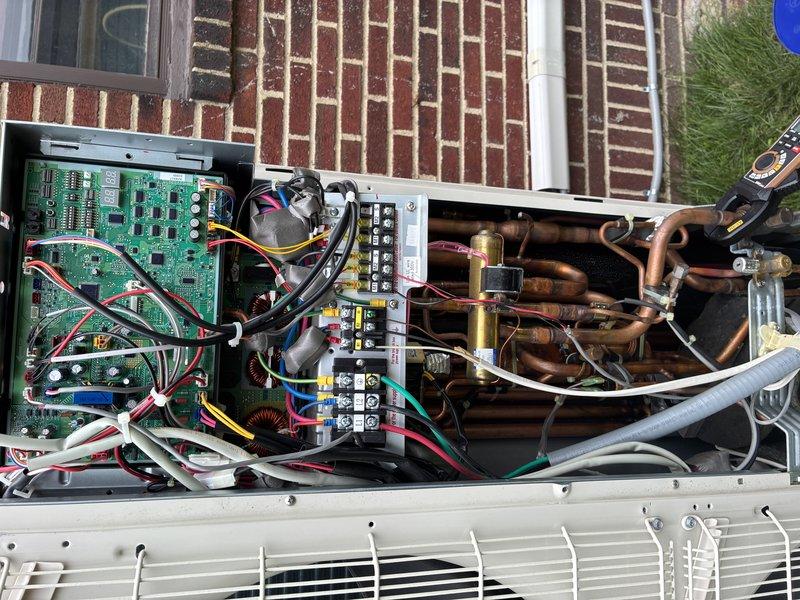 Responded to service call for multiple mini-split systems that failed to operate following a power outage. Performed diagnostic inspection of outdoor condensing unit, accessing internal control panel and electrical components. Inspected control boards, capacitors, wiring connections, and refrigerant line set for damage or loose connections caused by power surge. All circuit boards, capacitors, terminal blocks, and electrical connections were examined and found to be in functional condition with no visible signs of electrical damage or component failure.