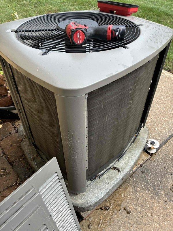Completed routine cooling maintenance visit on 7-year-old air conditioning system. Performed comprehensive inspection of outdoor condenser unit, including electrical diagnostics using clamp meter which showed 4.90 amp draw. Accessed control panel to verify proper electrical connections and component operation, documenting system performance through photos for service records.