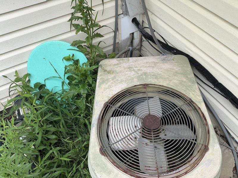 Completed estimate for dual HVAC system replacement at residential property. Assessed outdoor condenser unit showing significant age and weathering, with vegetation encroachment requiring clearance for proper operation. Evaluated interior furnace system and confirmed one system non-operational. Provided replacement options for both heating and cooling equipment to restore full climate control functionality.