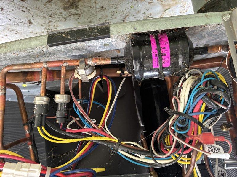 Completed annual preventive maintenance on a 2-year-old Lennox electric furnace and heat pump system. Performed comprehensive system inspection including visual assessment of outdoor condenser unit, verified proper installation on concrete pad with adequate clearance, and confirmed unit integrity with no visible damage or excessive wear. Inspected internal components including compressor, copper refrigerant lines, electrical connections, and wiring harness for signs of deterioration or loose connections. Cleaned condenser coils and checked for proper airflow through heat exchanger fins. Tested all electrical connections and verified secure wire terminations throughout the system. Evaluated refrigerant lines for oxidation and proper insulation. Confirmed compressor operation and checked for unusual vibrations or noise. System operating within normal parameters with no deficiencies noted. All components functioning properly for a unit of this age. Recommended continued annual maintenance
