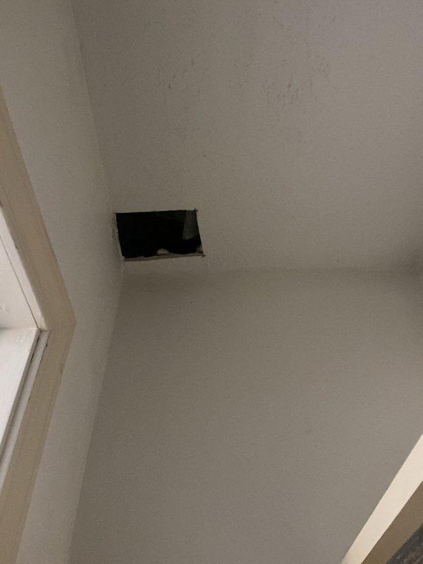 Converted existing three-way switch controlling living room outlet to constant power configuration and installed new ceiling fan circuit. Ran 3-wire switch leg from existing switch location through ceiling to center of room, cutting access through drywall as needed to route wiring. Installed fan-rated junction box at ceiling center for future customer installation of ceiling fan. In two upstairs bathrooms, removed existing outlets and standard boxes, then installed new single-gang old work boxes and wired customer-supplied GFCI receptacles. Made straight cuts in drywall where possible and secured cut pieces back in place where feasible.
