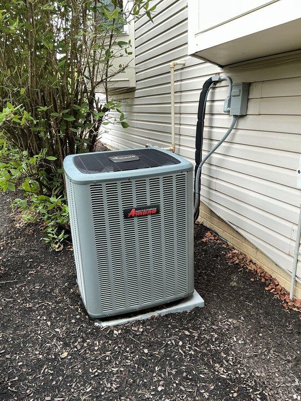 Responded to service call for AC unit tripping breaker and blowing warm air. Upon arrival, inspected Amana outdoor condensing unit and indoor air handler system. Diagnosed electrical issue causing breaker to trip and identified failed compressor contactor preventing proper cooling cycle. Replaced faulty contactor, tested electrical connections, and verified proper amperage draw. System restored to normal operation with cold air discharge confirmed at supply registers.