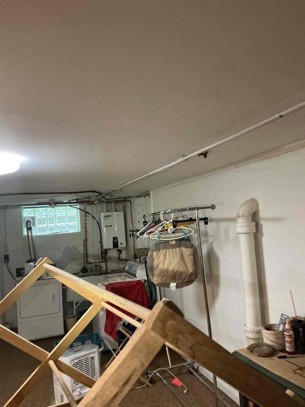Conducted comprehensive electrical assessment for standby generator installation at residential property. Evaluated existing main electrical panel and garage space to determine optimal generator placement and transfer switch integration requirements. Documented current electrical infrastructure including main breaker configuration and available installation area within garage, considering clearance requirements and utility access for future generator unit positioning.