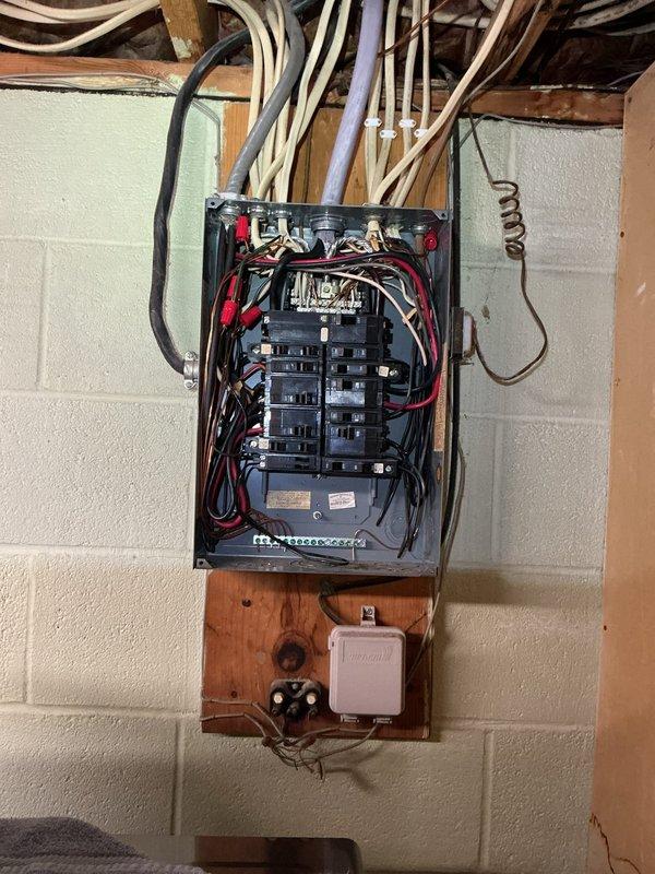 Installed dedicated electrical circuit for tankless water heater system. Ran new flexible metal conduit from main electrical panel through wall framing to equipment location, mounted junction box, and connected appropriate circuit breaker in panel to support tankless unit power requirements.