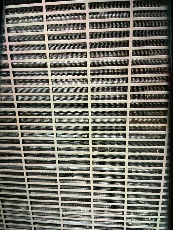 Performed comprehensive AC tune-up on a five-year-old window-mounted air conditioning unit. Completed full system inspection including condenser coil examination, verified proper airflow through protective grille assembly, and confirmed all mechanical components operating within normal parameters. Unit showed clean coils with no debris accumulation and maintained appropriate cooling function throughout testing sequence.