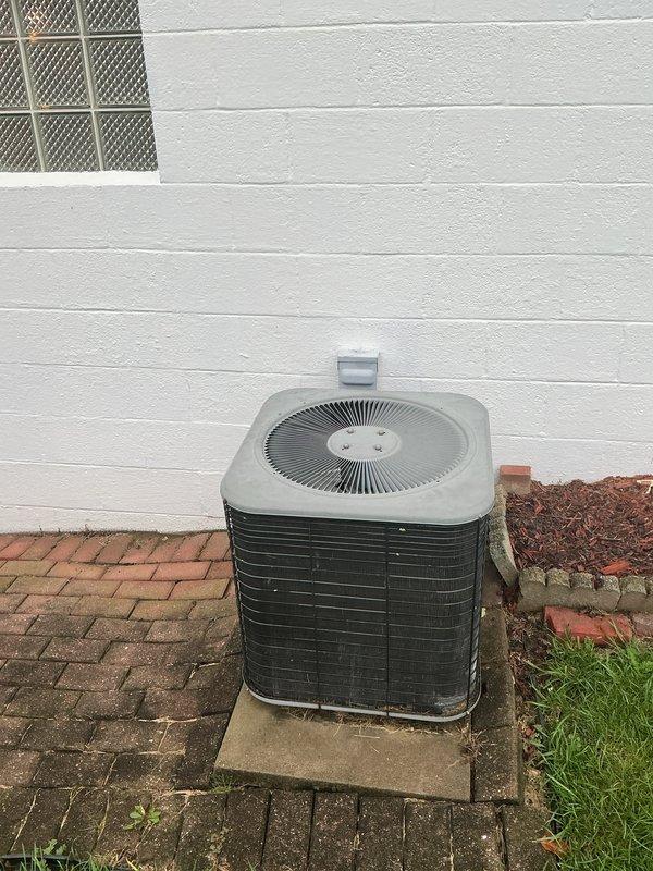 Completed full HVAC system installation including a 90% efficiency furnace, central air conditioning unit, and tankless water heater. The furnace was installed in the basement mechanical room against the existing brick wall with proper ductwork connections and venting. The outdoor condensing unit was positioned on a concrete pad against the foundation with appropriate clearances and electrical connections. All equipment was tested for proper operation and system performance verified upon completion.