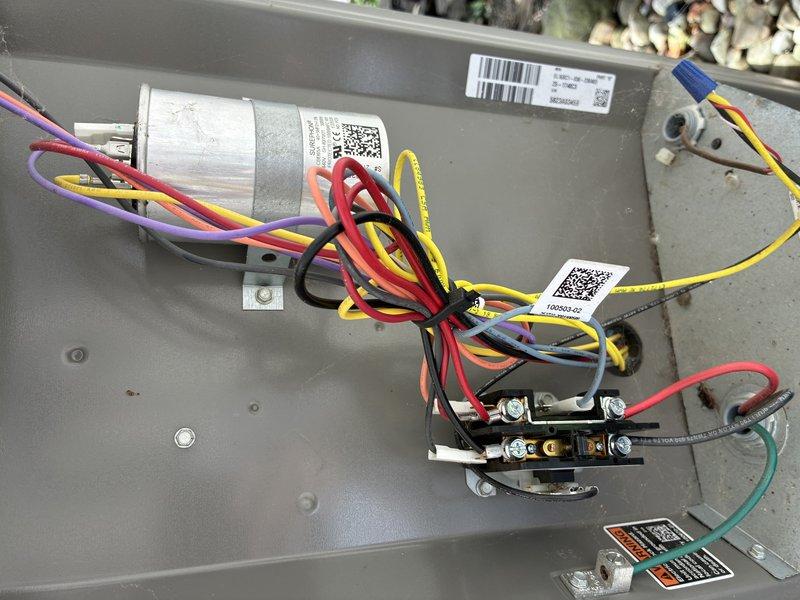 Completed comprehensive MVP maintenance service on a two-year-old residential air conditioning system with no reported issues. Performed standard AC tune-up procedures including inspection of blower wheel assembly, which showed normal operational wear with minor dust accumulation on blades but remained in functional condition. Examined electrical control panel components including capacitor, contactor assembly, and all associated wiring connections; verified all color-coded wires were properly secured with appropriate terminations and cable management. All system components photographed and documented for maintenance records, with system confirmed operational and ready for continued service through 2026 MVP coverage period.