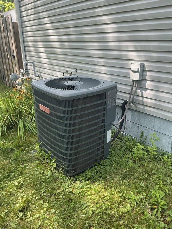 Completed MVP recurring cooling maintenance visit on residential split system air conditioning unit. Inspected outdoor condenser unit and indoor evaporator coil assembly, documenting equipment condition through photographic records. Evaporator coil exhibited moderate dust and debris accumulation between fins requiring attention during preventive maintenance service. Outdoor condenser unit operational with refrigerant lines, electrical connections, and disconnect box verified in serviceable condition. System assessed and documented as part of ongoing maintenance program to ensure optimal cooling performance and equipment longevity.