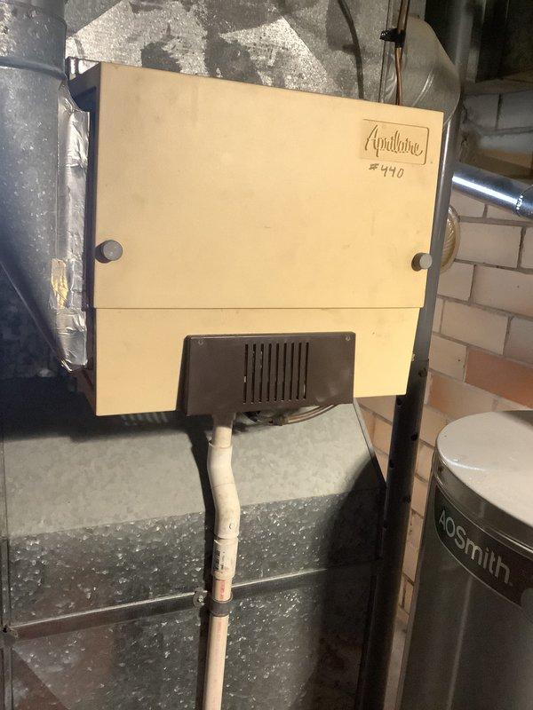 Conducted on-site evaluation for furnace replacement of existing 22-year-old gas heating system. Assessed current Armstrong Air furnace installation, associated ductwork, venting configuration, and auxiliary equipment including Aprilaire humidifier system. Documented existing equipment specifications, physical layout, and mechanical connections. Photographed current system setup showing furnace unit, electrical disconnect, gas piping assembly with shutoff valves, exhaust/intake venting, and surrounding utility space infrastructure. Provided comprehensive replacement estimate for new high-efficiency gas furnace installation with proper venting and all necessary connections to existing duct system.