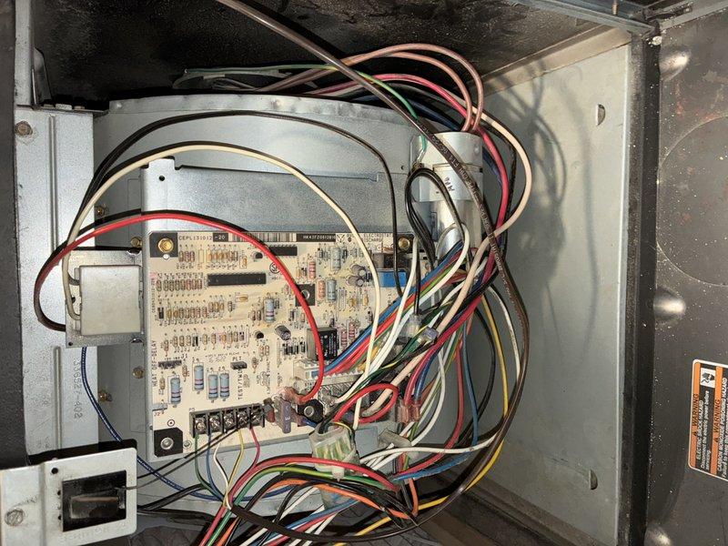 Completed scheduled MVP heating maintenance visit on Carrier furnace system. Performed comprehensive inspection of unit including control board examination, electrical connections verification, and overall system assessment. All components operating within normal parameters, circuit board connections secure, and unit functioning properly. Documentation photos captured of furnace installation and internal control panel for service records.