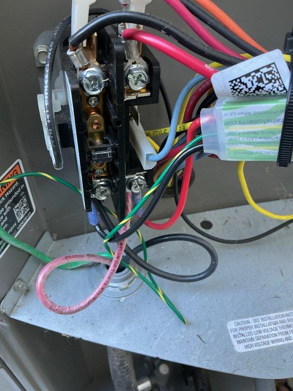 Completed MVP cooling maintenance visit on 2-year-old system with condenser unit located outdoors and air handler in attic. Performed comprehensive inspection of outdoor condenser unit including fan operation, refrigerant line connections, and electrical components. Inspected electrical panel wiring, terminal connections, and control circuits to ensure proper system operation and safety compliance.