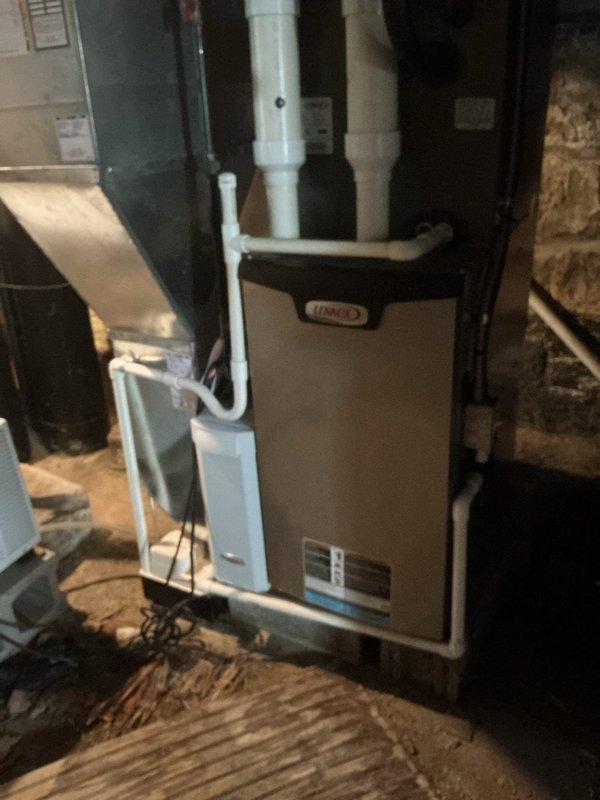 Completed routine maintenance visit for MVP customer's cooling system. Inspected indoor Lennox furnace unit in basement and outdoor condensing unit, verifying proper installation, venting configuration, and refrigerant line connections. Both units operating within normal parameters with no visible damage or service issues identified at time of inspection.