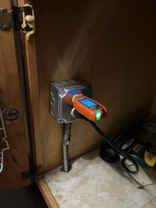 Responded to non-functional dishwasher outlet and discovered existing circuit was not up to code. Removed non-compliant wiring from junction box in basement and installed new dedicated line using flexible conduit run to surface-mounted four-square box with duplex receptacle in cabinet. Added GFCI protection at electrical panel to bring installation into compliance with current electrical code requirements.