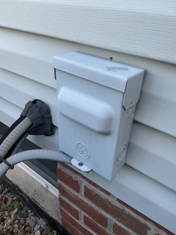 Completed comprehensive tune-up on 6-year-old air conditioning system, including inspection of exterior disconnect box and contactor assembly. Observed accumulated debris and cobwebs around electrical connections indicating need for routine maintenance; cleaned terminals and verified proper electrical connections on contactor with multiple wire terminations. Installed complimentary carbon monoxide detector as part of seasonal safety promotion.