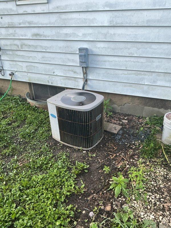Completed installation of a new 80% efficiency furnace and air conditioning system. The furnace was installed in the basement with new ductwork and plenum connections, while the outdoor condenser unit was positioned against the exterior wall with proper electrical disconnect and conduit routing. Both units were tested and confirmed operational upon completion.