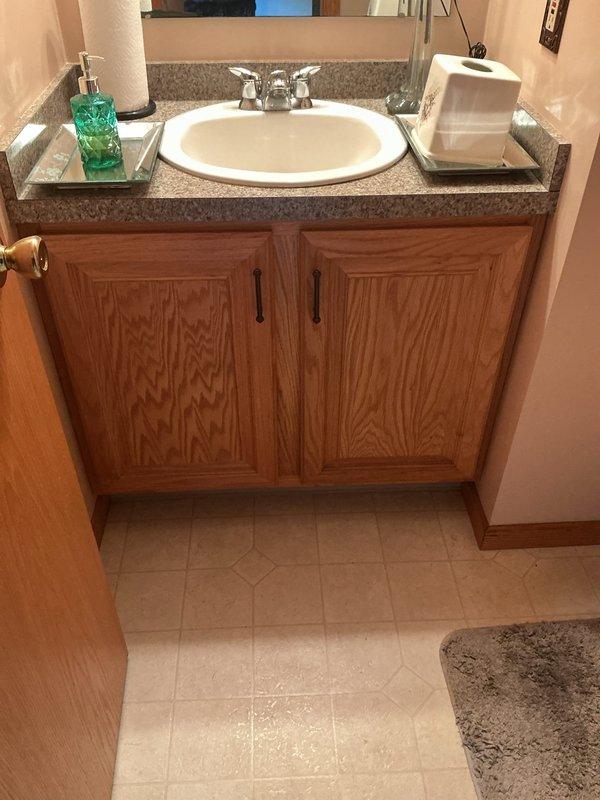 Responded to emergency call for tub faucet stuck in open position with no accessible shut-off valves. Located and operated main water shut-off to stop water flow. Inspected bathroom plumbing system and identified faulty tub faucet mechanism causing continuous water discharge. Repaired or replaced defective faucet components to restore proper operation and water control.