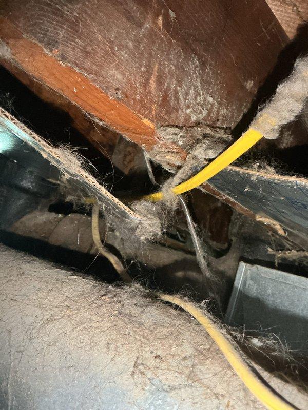 Responded to service call for 3-month-old air conditioning unit running continuously without cycling off. Upon inspection, identified malfunctioning printed circuit board (PCB) preventing proper thermostat communication and system shutdown. Customer had been manually turning off unit at breaker to stop operation. Documented attic installation and basement mechanical areas, noting system configuration and wiring paths. Assessed control board failure as primary cause of continuous operation issue and provided recommendations for PCB replacement to restore normal cycling function.