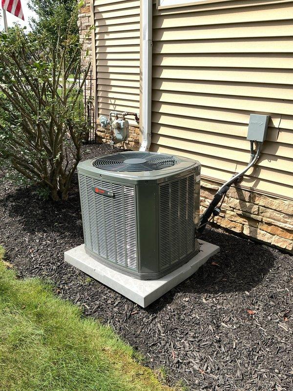 Completed MVP cooling maintenance visit on 6-year-old Trane furnace and Rheem air conditioning system that had been rescheduled from previous date. Performed comprehensive inspection of indoor furnace unit with heat exchanger and outdoor condensing unit, verified all components operating within normal parameters, checked refrigerant levels and electrical connections, inspected condensate drainage system and PVC venting, and documented system condition with photographs showing equipment in good working order with proper installation on concrete pad and adequate clearances maintained.