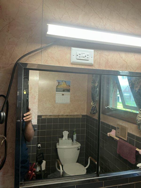 Responded to recurring electrical issue in bathroom where lights were not functioning properly. After previous service calls related to problematic outlet, removed and permanently capped off the defective bathroom outlet per customer request to eliminate ongoing issues with the circuit.