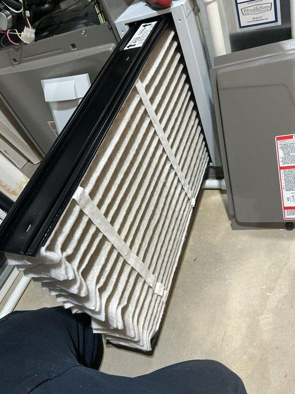 Performed comprehensive AC tune-up on 5-year-old cooling system. Conducted system diagnostics using digital measuring equipment to verify airflow and operational parameters, with readings indicating proper system performance at 642 CFM. Inspected and evaluated air filter condition, noting moderate dust accumulation on pleated media; filter remains serviceable but approaching replacement interval. Completed standard maintenance protocol including visual inspection of ductwork, refrigerant lines, and system components to ensure optimal cooling system operation for the season.