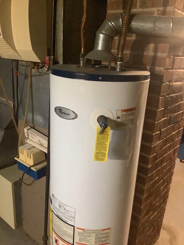 Conducted comprehensive HVAC system evaluation for potential equipment replacement. Assessed existing outdoor condensing unit and indoor furnace system, documented current equipment age and operating condition, and photographed all components including the air conditioning condenser, furnace unit, refrigerant line routing, electrical connections, and condensate management. Discussed replacement versus repair options with customer and provided information regarding available financing programs for new system installation.