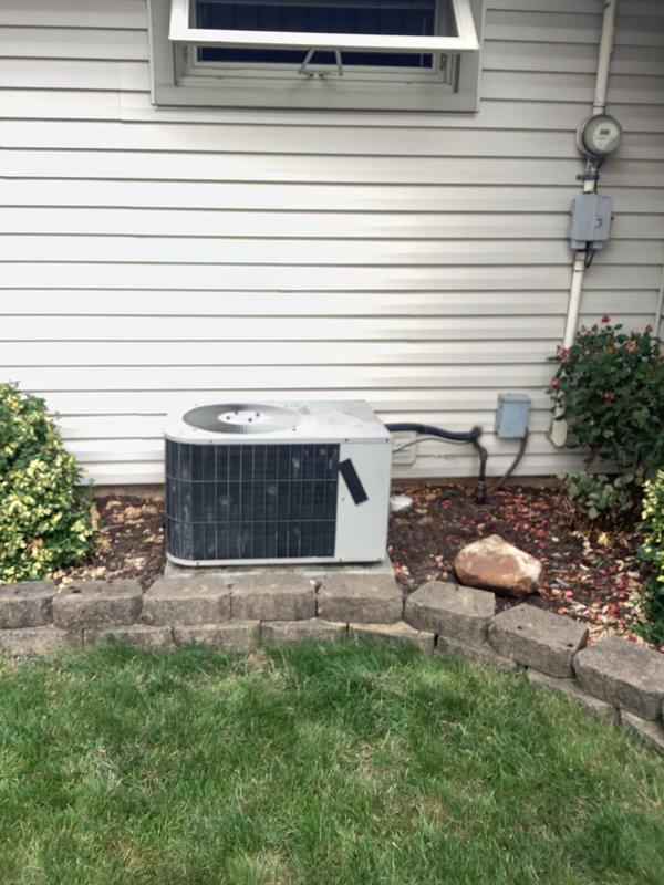 Conducted comprehensive HVAC system evaluation for potential equipment replacement. Assessed existing outdoor condensing unit and indoor furnace system, documented current equipment age and operating condition, and photographed all components including the air conditioning condenser, furnace unit, refrigerant line routing, electrical connections, and condensate management. Discussed replacement versus repair options with customer and provided information regarding available financing programs for new system installation.