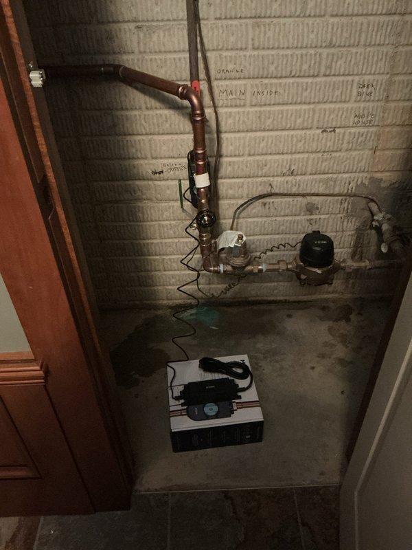 Installed 8/830-KS unit in basement utility space with copper piping connections. Configured plumbing connections including U-bend trap assembly and associated fittings to integrate new equipment with existing water line system. Unit is currently set up for temporary power via extension cord per customer request, with permanent electrical outlet to be installed at later date. All copper pipe connections completed and system pressure-tested for proper operation.