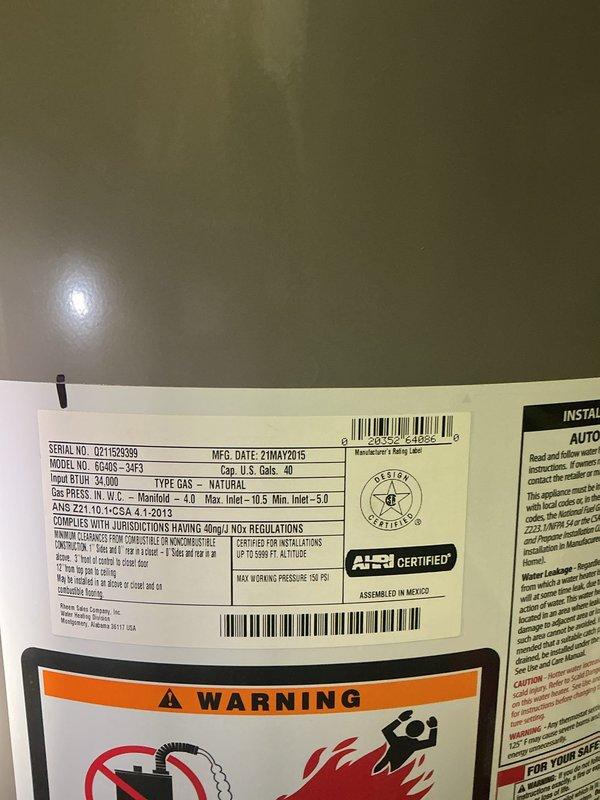 Responded to service call for non-operational water heater. Upon arrival, inspected Richmond-branded 40-gallon natural gas water heater (Model BC49S-34F3, 34,000 BTU input) manufactured in May 2015. Documented unit specifications including serial number U211625339, maximum working pressure rating of 150 PSI, and AHRI certification. Performed visual assessment of unit condition, plumbing connections including copper piping and brass fittings, blue valve mechanism at base, and overall installation setup in basement utility area. Photographed water heater labels, warning decals, and technical specification plates for service records. Provided free estimate for necessary repairs or replacement options to restore hot water functionality.