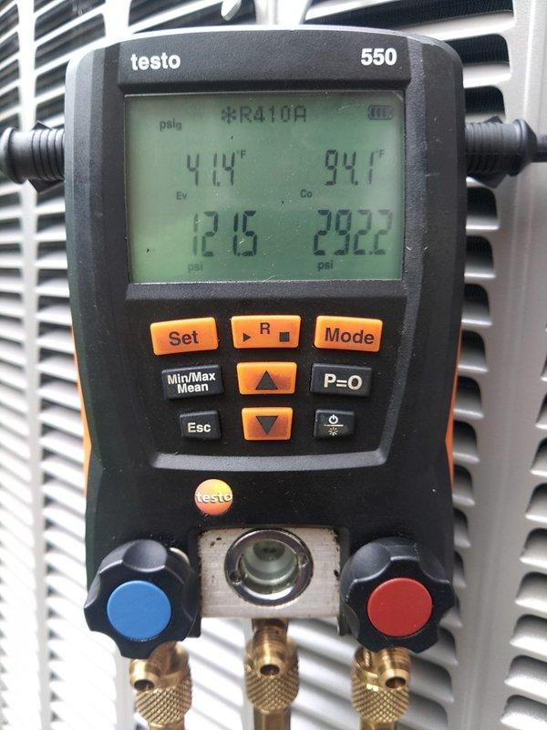 Completed full system replacement under warranty at residential property. Accessed property using provided garage code, removed existing HVAC equipment and installed new system. Verified proper refrigerant charge of R410A using digital manifold gauges, with system pressures reading 121.6 psi on low side and 292.2 psi on high side at operating temperatures of 41°F evaporator and 94°F condenser. Inspected outdoor unit installation including lineset connections, service valves, and electrical conduit routing. Confirmed all copper piping properly insulated and secured on protective pad with appropriate clearances. Documented system performance with photos showing gauge readings and exterior equipment installation. Transported old equipment back to shop for disposal. System operating within manufacturer specifications upon completion.