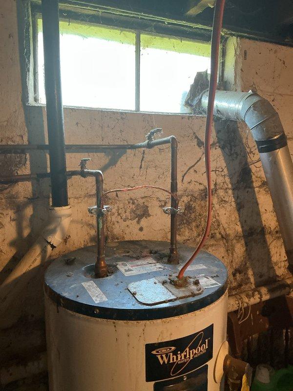 Conducted free estimate for replacement of existing 40-gallon Whirlpool electric water heater located in basement utility area. Assessed current installation including copper supply piping, electrical connections, and plumbing configuration extending from top of unit. Identified additional issue with non-functioning interior water shut-off valve requiring repair or replacement to enable proper isolation of water supply during future service work. Documented existing conditions including water heater placement, surrounding mechanical systems, HVAC ductwork proximity, and basement environment for accurate proposal preparation.